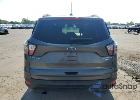 2017 Ford Escape Titanium z USA, uszkodzony, nr VIN 1FMCU9J99HUE93325